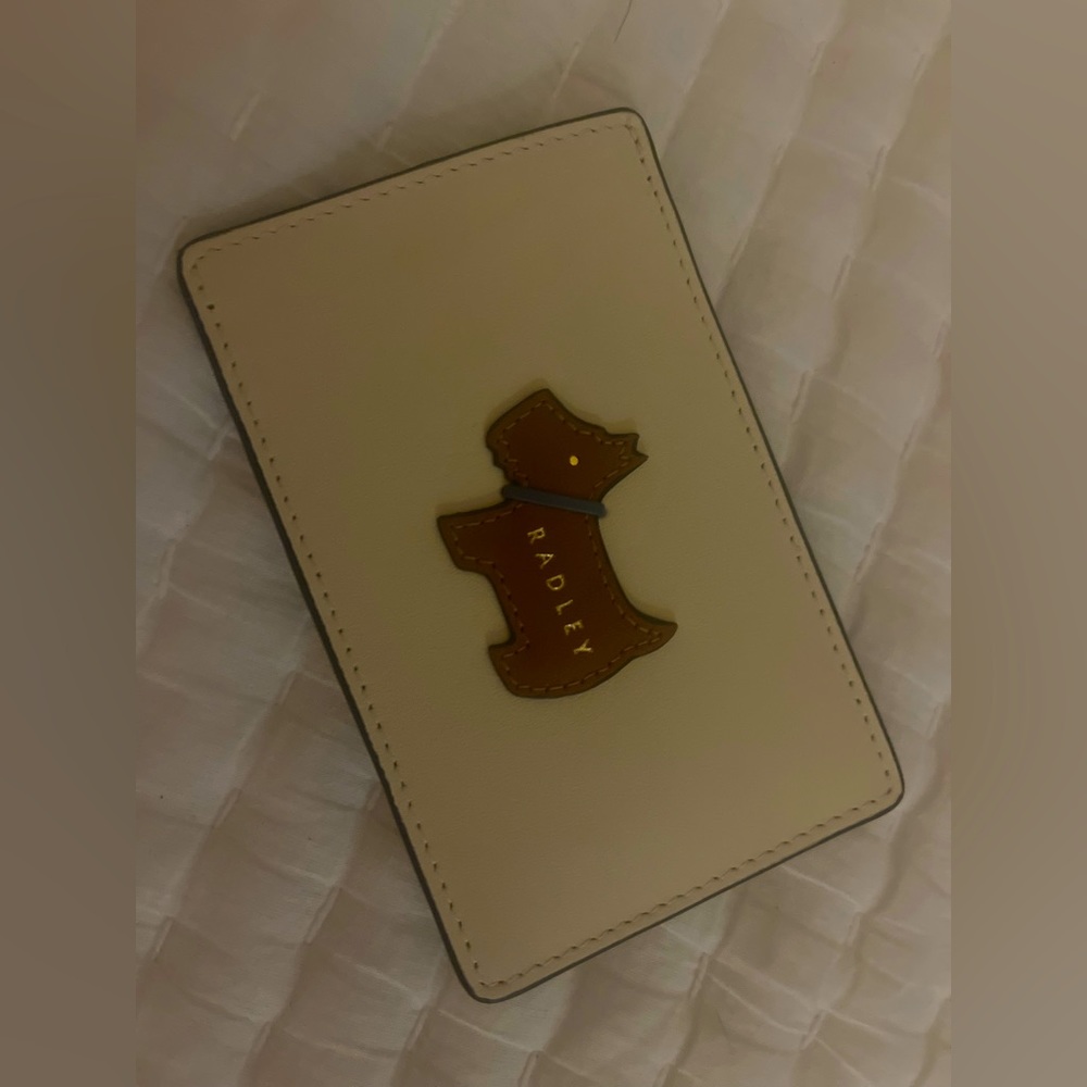 ID holder by Radley London.  Super cute and sleek to hold your ID or credit card